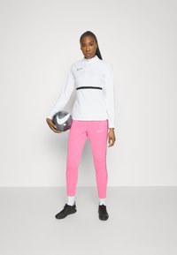 Nike Performance ACADEMY PANTS - Jogginghose - pink glow/cosmic fuchsia/white
