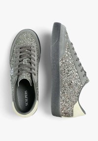 Glitter-covered gray sneakers with a textured midsole, flat laces, and a cream-colored accent on the heel. Brand name visible inside.