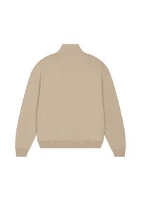 Giacca pullover beige in misto cotone con colletto alto, spalle scese e polsini e orlo a coste, caratterizzata da una texture liscia e un design minimalista.