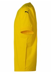 T-shirt giallo a maniche corte in cotone, con scollatura tonda e logo Puma nero sulla spalla sinistra. Polsini texturizzati.