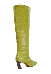 Green, knee-high leather boot with a crocodile texture and a pointed toe. Features a stacked heel for added height.