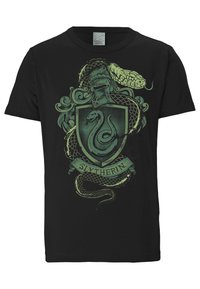 Black t-shirt featuring a green Slytherin emblem with a serpent, intricate designs, and a banner reading "Slytherin" at the bottom.