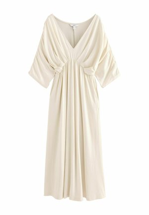 Cream-colored dress made of soft fabric, featuring a deep V-neck, short batwing sleeves, gathering at the waist, and a relaxed, flowing silhouette.