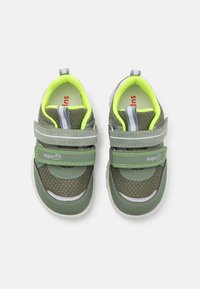 Green synthetic shoes with mesh texture, velcro straps, and bright yellow accent lining. Features white rubber soles and branding detail.