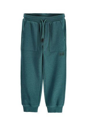Teal green children's sweatpants with elastic waistband, drawstring, front pockets, ribbed cuffs, and small printed text on left leg.