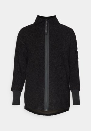 Black fleece jacket with high collar and half-zip front. Features long sleeves with ribbed cuffs and a curved hem design.