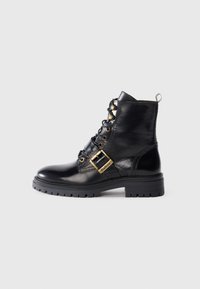 Black leather ankle boot with gold hardware, lace-up front, side buckle detail, and textured sole. Smooth finish with a rounded toe.