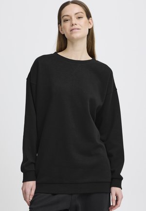 Black sweatshirt with long sleeves, crew neck, and a relaxed fit. Made of soft fabric with a smooth texture, featuring ribbed cuffs and hem.