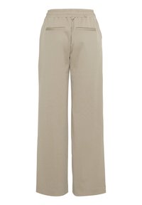 Pantalon beige à jambes larges avec taille élastiquée et deux poches fendues à l’arrière, présenté de dos sur fond blanc.