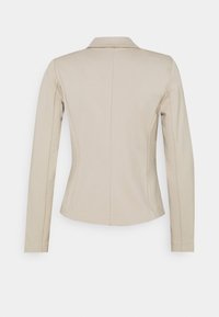 Beige taillierter Blazer mit langen Ärmeln, einem Reverskragen und einer glatten Textur. Verfügt über ein sauberes, minimalistisches Rückendesign und maßgeschneiderte Nähte.