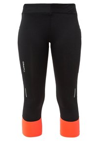 Leggings deportivos negros con un acento naranja en la parte inferior, fabricados con material elástico, con detalles reflectantes en los lados.