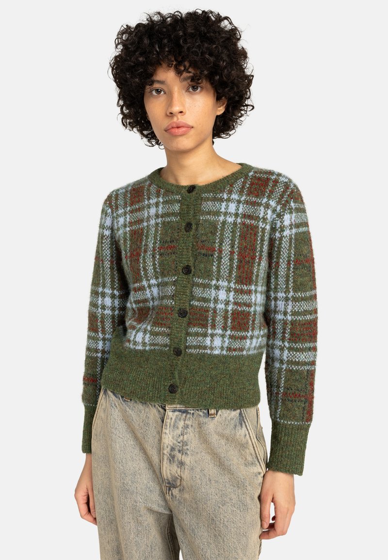 Zöld kockás kardigán kék és piros mintákkal, gombos elülső résszel, bordázott mandzsettákkal és aljjal, texturált kötött anyagból készült.