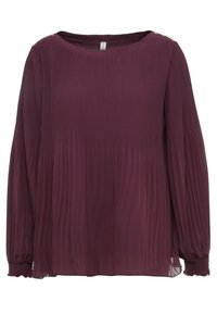 Långärmad blus i mörklila med veck, rund halsringning och knappdetaljer på axlarna, samlade manschetter och flödande tyg.