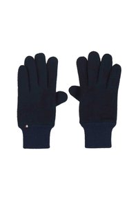 Paire de gants en tricot bleu marine avec des poignets côtelés, posés à plat avec les paumes vers le bas sur un fond blanc.