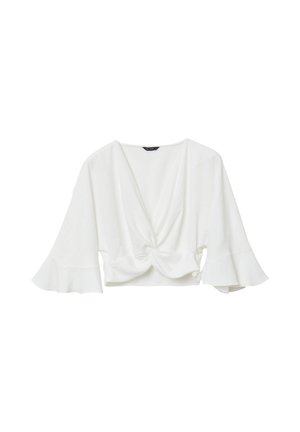 Top blanc court avec un décolleté en V profond, détail noué à l'avant et manches évasées. Fabriqué en tissu léger avec une texture douce.