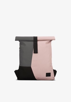 Rolled-top backpack in gray, pink, and black, featuring a smooth texture, adjustable straps, and a small logo patch on the front.
