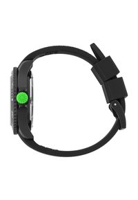 Black digital watch with a textured silicone strap, featuring a large green crown and a square, geometric watch face.