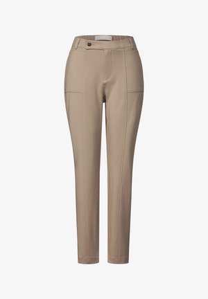 Pantalons beiges à coupe slim, dotés de deux poches avant, de fausses coutures avant et d'une fermeture à bouton. Fabriqués dans un tissu lisse et extensible.