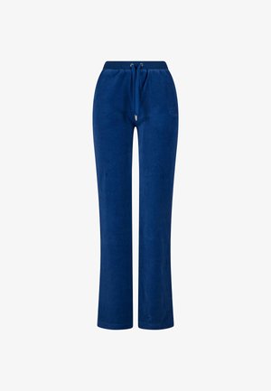 Jūrinės mėlynos velūro sportinės kelnės su raišteliu juosmens srityje, tiesiomis kojomis ir subtiliu siuvinėtu logotipu ant klubo. Minkšta tekstūra.