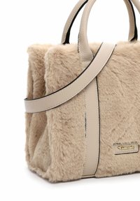 Faux fur handbag in beige with a smooth leather strap and handles. Features a gold logo plaque and contrasting black trim. Compact design.