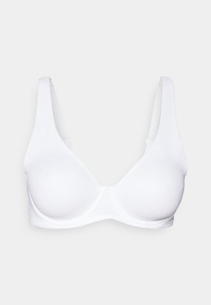 White lightly textured underwire bra with thick adjustable straps and molded cups on a plain background.