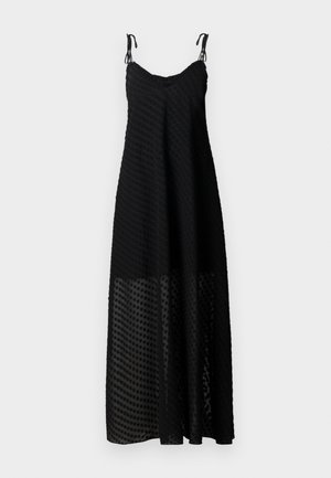 Black maxi dress with spaghetti straps, featuring a textured polka dot pattern and a sheer lower panel. Lightweight fabric, relaxed fit.