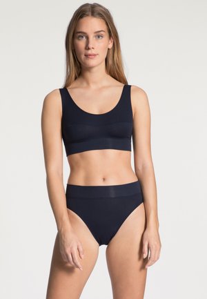 Navy blue bra and high-waisted panty set made of soft fabric. Bra features wide straps and a seamless design, while the panty has a smooth finish.
