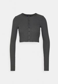 Mörkgrå, räfflad långärmad kort cardigan med rund halsringning och knapplåstning fram. Mjuk textur och figurnära passform.