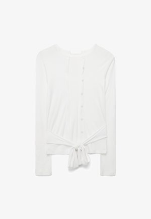 Biały, długi sweter na guziki z długim rękawem, okrągłym dekoltem i wiązaniem z przodu w talii.