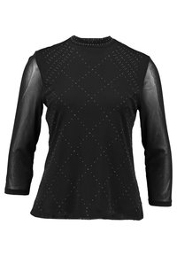 T-shirt noir à manches longues avec un motif en losanges de petits strass sur un tissu texturé et des manches transparentes. Encolure ronde, design ajusté.