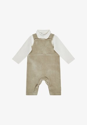 Beige corduroy overall with a white long-sleeve shirt underneath. Features a small embroidered dog design on the front and button details.