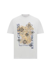 Camiseta de algodón blanca con gráficos florales coloridos en azul y amarillo, con "GUESS" y "EST. 1981" impresos en letras gruesas.