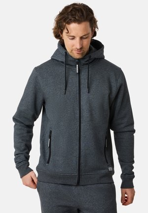 Grå zip-up hoodie med hætte, forlommer og snore. Lavet af et blødt, struktureret stof med en afslappet pasform.