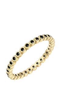 Anillo de oro de eternidad con pequeñas piedras preciosas negras distribuidas uniformemente alrededor de la banda.