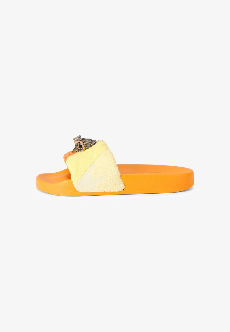 Orange slide sandal with yellow fabric strap featuring a metallic owl decoration on a white background.