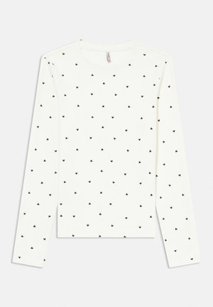 Valge pikkade varrukatega särk väikeste hajutatud mustade südamemustritega, ümara kaelusega ja tavalise lõikega.