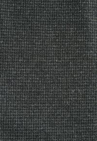 Gray houndstooth fabric with a textured surface; features a fine, woven pattern in varying shades of gray, creating subtle depth.