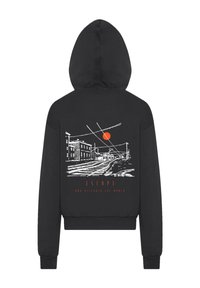 Black hoodie with a drawstring hood. Back features a white illustration of buildings and train tracks with an orange sun and "ESCAPE."