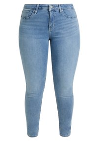 Vaqueros skinny de color azul claro, fabricados en denim, que cuentan con un clásico diseño de cinco bolsillos, pasadores para cinturón y un cierre frontal con botón. Textura suave.