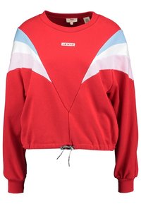 Červená fleecová mikina s kontrastními modrými a bílými diagonálními panely, krátký střih, kulatý výstřih a spodní lem se stahovací šňůrkou. Na přední straně logo Levi's.