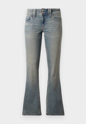 Light blue flared jeans made from denim. Features two front pockets, a button closure, and subtle fading across the fabric.
