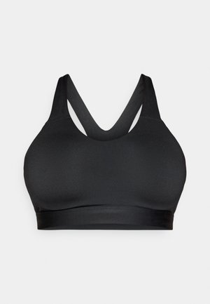 Brassière de sport noire avec une finition mate et lisse, dotée de larges bretelles croisées et d'une bande de soutien en bas.