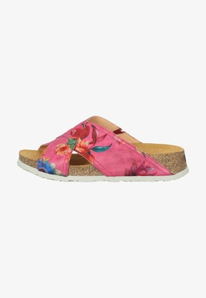 Pink floral slip-on sandals with crisscross straps, cork midsole, and white rubber outsole. Features vibrant botanical patterns on the upper.