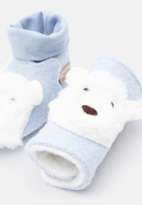 Soft light blue baby booties with white fluffy sheep faces and brown embroidered noses on a plain white background.