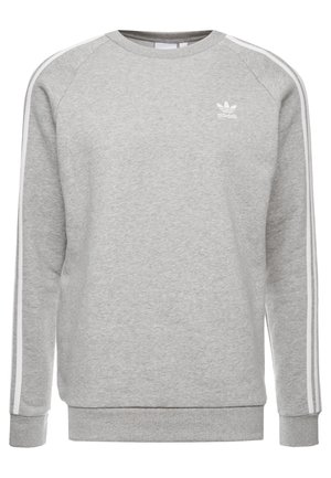 Vaaleanharmaa Adidas-collegepaita, jossa valkoiset kolme raitaa hihoissa ja pieni valkoinen Adidas-logo rinnassa.