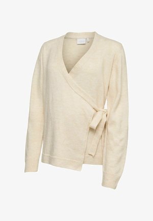 Krémový pletený sveter s dlhými rukávmi a bočným zaväzovaním.
