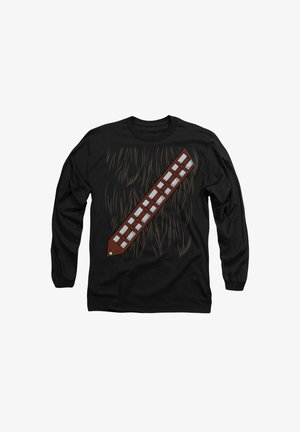 Long-sleeve black shirt featuring a graphic of brown fur and a brown bandolier with light-colored squares, resembling a character from fiction.