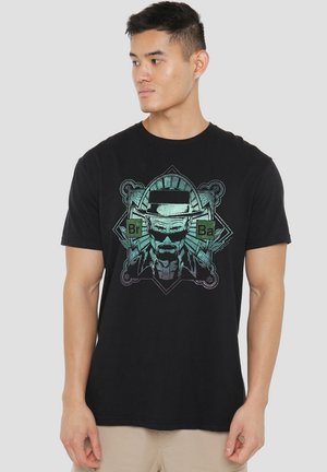 Black cotton t-shirt featuring a graphic print of a character wearing sunglasses and a hat, with green accents and geometric designs.