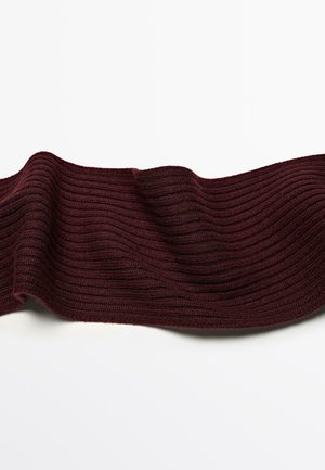 Burgundy ribbed knit fabric with a soft texture, flowing in waves. The pattern features horizontal ridges, creating visual depth.