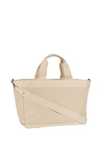 Beżowa torba na ramię z płótna z dwoma krótkimi uchwytami, długim regulowanym paskiem i teksturowaną powierzchnią. Posiada zamknięcie na suwak u góry.